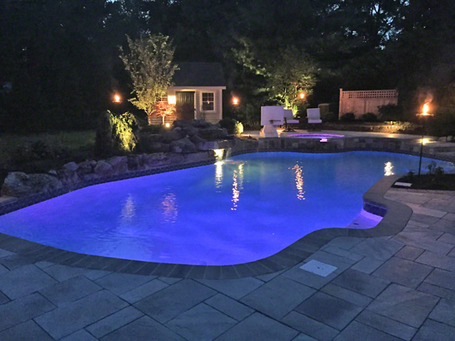 Concrete Pool with Stone Paver Decking and pool house